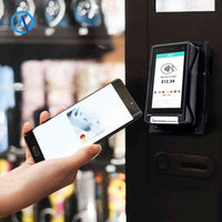 Self-service POS terminal mounted on wall for retail payment transactions