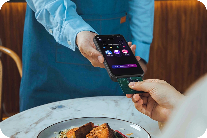 PAX A6630 taking a tableside contactless payment in a restaurant