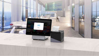 Modern retail space with POS system featuring PAX ELYS tablet and printer for efficient transactions
