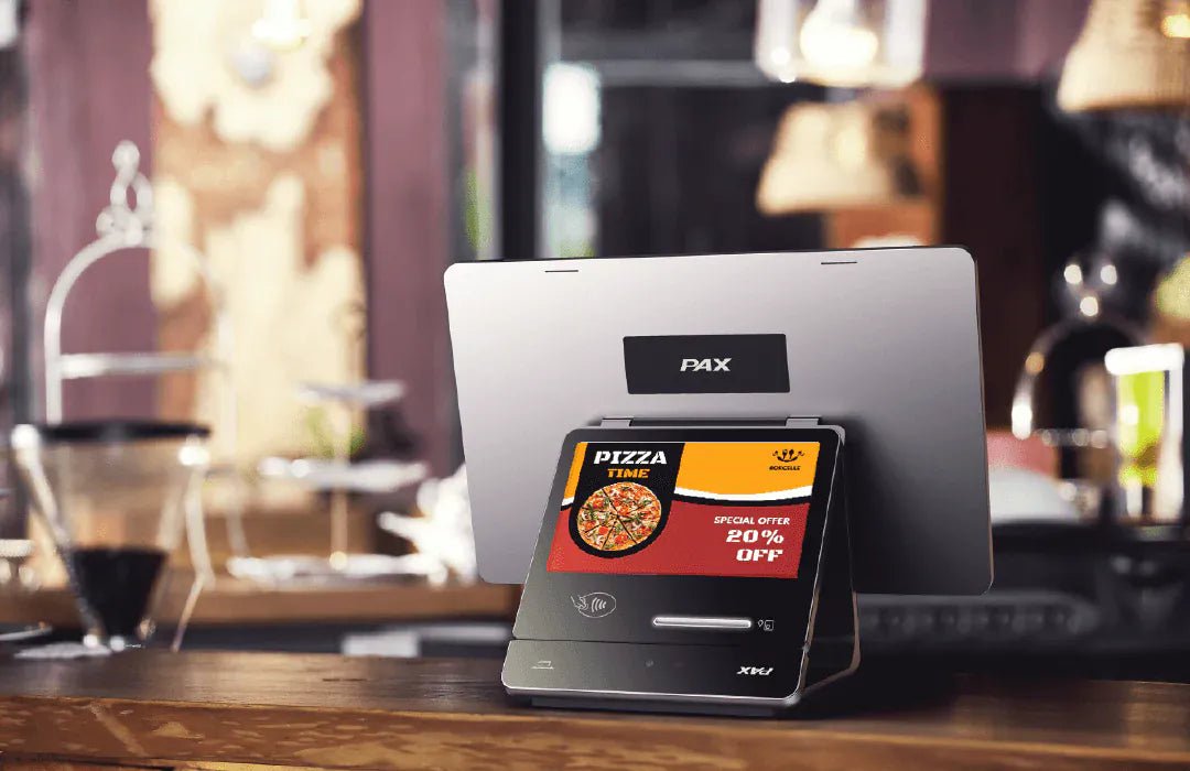 Close-up of PAX ELYS POS terminal with touchscreen display and receipt printer for business use