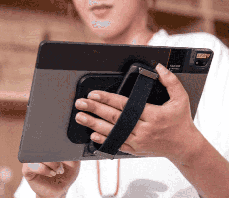 Person holding SUNMI CPad with ergonomic hand rest and rotating support stand