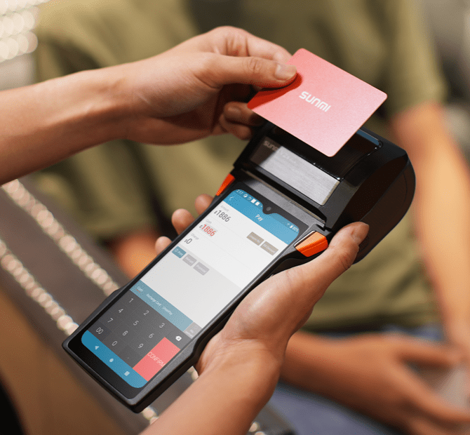 Person using SUNMI V2s POS with card payment, mobile payment, and receipt printing features