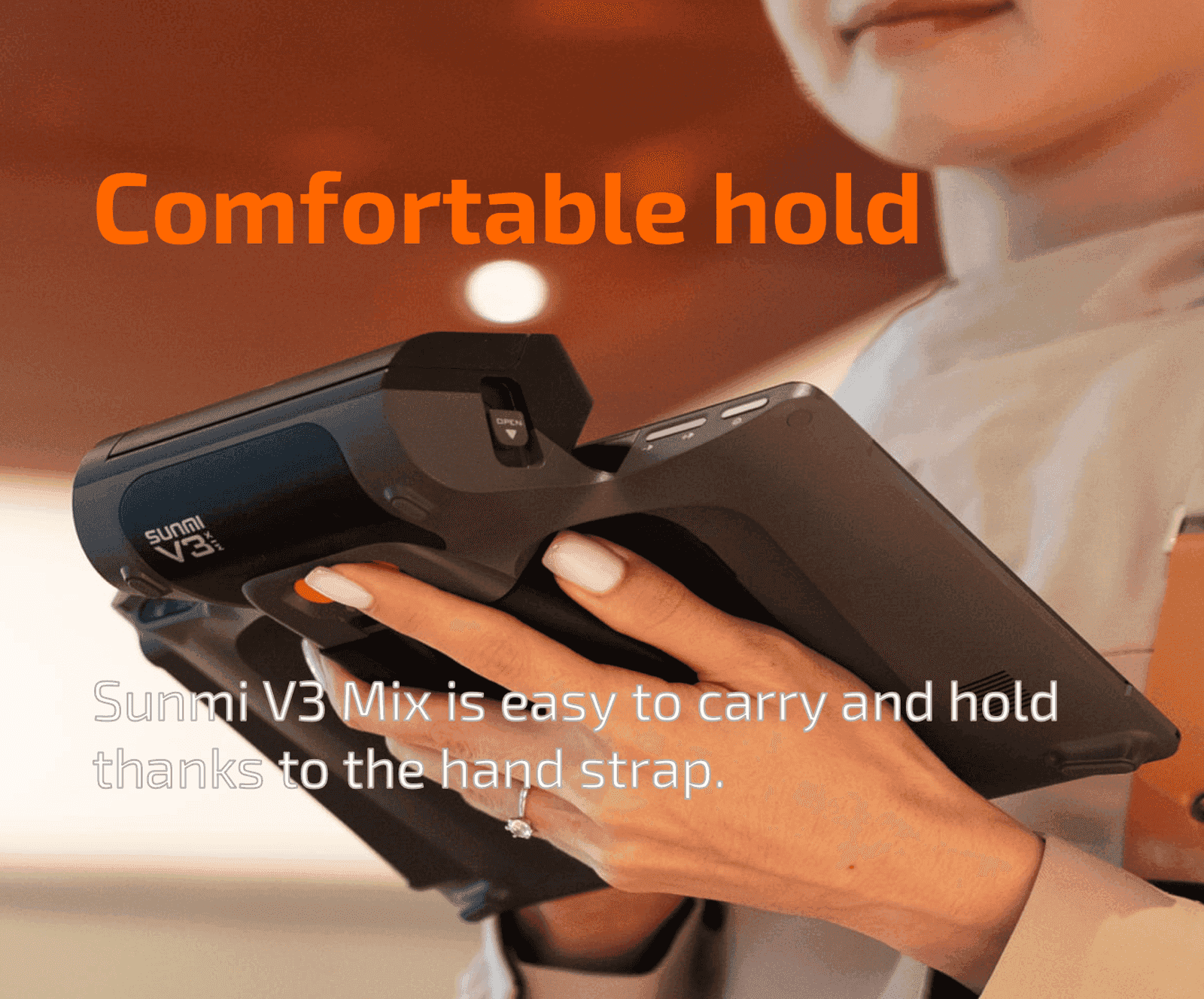 Person holding SUNMI V3 device with hand strap for comfortable use