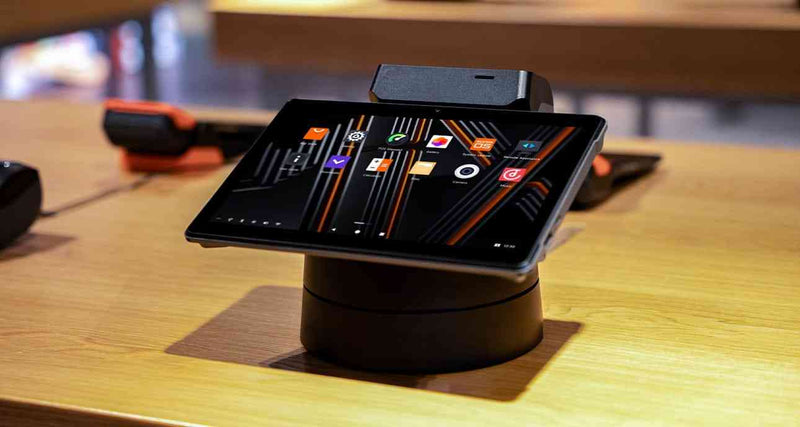 SUNMI V3 MIX Android POS tablet with printer on a wooden table for business use