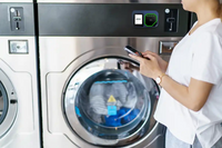ID TECH VP7225 card reader installed on a laundry machine