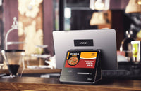 PAX ELYS A3700 tablet payment terminal displaying a pizza promotion